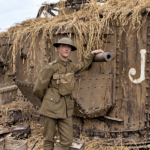 WWI Soldier Beside Mark V Tank